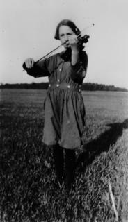 Young Virginia Apgar practicing her violin in the open air, 1920s
