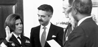 Surgeon General Antonia Novello is sworn in, as her husband, Dr. Joseph Novello, holds the Bible, March 9, 1990. Antonia C. Novello, M.D., M.P.H., Dr.P.H.