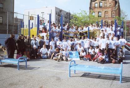 Barbara Barlow (bottom left) with volunteers at a playground build at PS 92 in Harlem, 2000