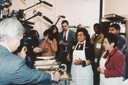 Surgeon General Joycelyn Elders and Secretary of the Department of Health and Human Services, Donna Shalala speaking to the media at a soup kitchen, 1994