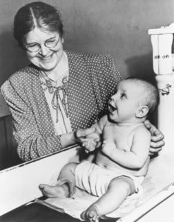Martha May Eliot, assistant chief of the Children's Bureau visiting a Child Health Clinic in Washington, 1945