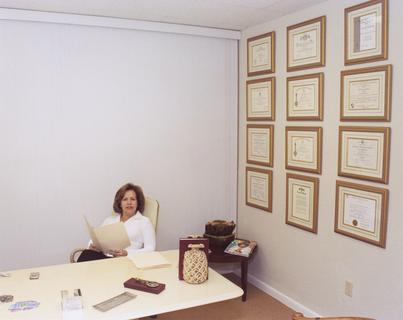 Yvette Laclaustra in her office, ca. 2002