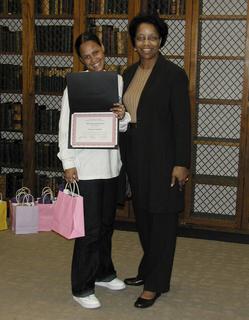 Joan Y. Reede with Annette Claudio of Martin Luther King Middle School at a 
