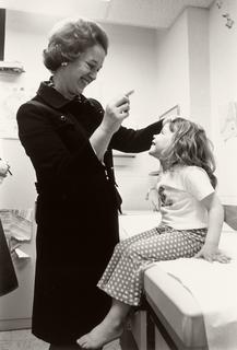Marianne Schuelein with a young patient at Georgetown University, 1980s