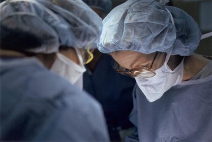 Kathryn D. Anderson performing in surgery, 2002