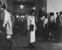 Edith Irby Jones standing alone in the hallway of the University of Arkansas Medical School, 1949