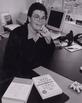 Susan Love, M.D. at her desk, with two of the books she has written for the public, ca. 2000