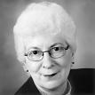 Full face photograph of Dr. Barbara Barlow wearing glasses.